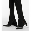 Schwarze Skinny Hose mit ausgestelltem Schlitz und langem Schlag